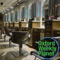 Beauty salon client chairs with the Oxford Weekly Planet logo in the foreground