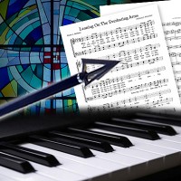 Piano keyboard, musical score, and an arrow in front of a stained glass window