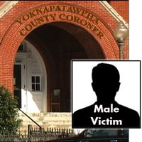 Entrance to the Yoknapatawpha County Coroner's Office with the label 'Male Victim'