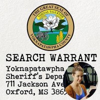 Seal of Yoknapatawpha County with the label 'Search Warrant' with an inset of a smiling young woman holding a book
