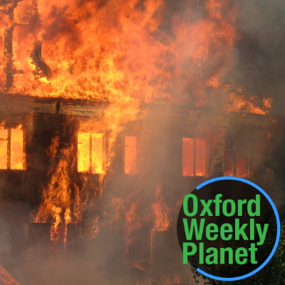 A residence engulfed in flames with the Oxford Weekly Planet logo in the foreground