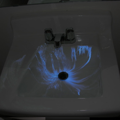 Luminol highlighting blood in a sink