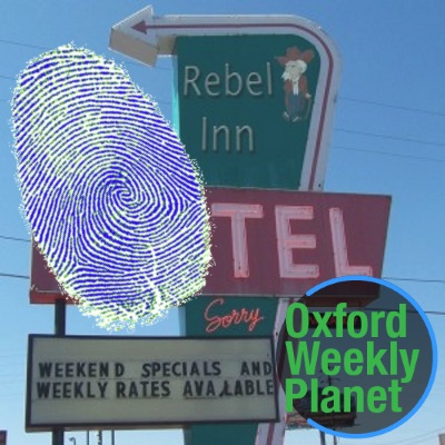 Motel sign with a fingerprint and the Oxford Weekly Planet logo in the foreground