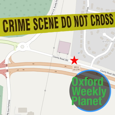 Map of crime scene location with crime scene tape and the Oxford Weekly Planet logo in the foreground