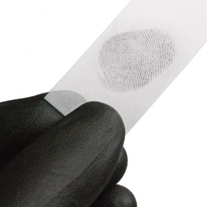 Gloved hand holding strip of paper with a fingerprint on it
