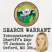Seal of Yoknapatawpha County with the label 'Search Warrant' with an inset of a woman with long blonde hair