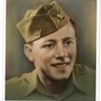 Old photo of a young, smiling man in a military uniform