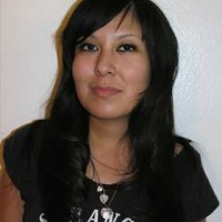 Smiling young woman with long dark hair