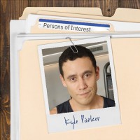 Photo of a fit young man with dark hair, clipped to a file folder