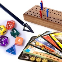 Peg board game, multisided dice, game cards and an arrow