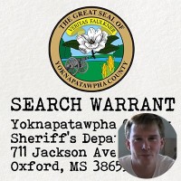 Seal of Yoknapatawpha County with the label 'Search Warrant' with an inset of a young man with short, light brown hair