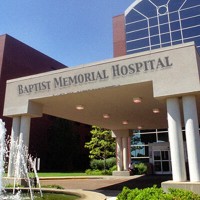 Hospital main entrance with the words "Witness Canvass" in the foreground