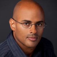 Young bald man with glasses