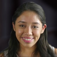 Smiling young woman with long dark hair