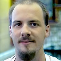Balding man with mustache and goatee