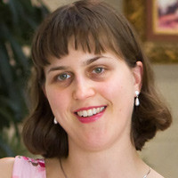 Smiling woman with a dark bob haircut