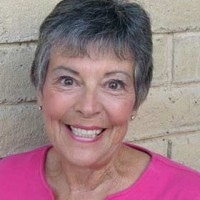 Smiling older woman with short salt-and-pepper hair