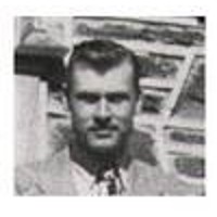 Old photo of a dark-haired man in a jacket and tie