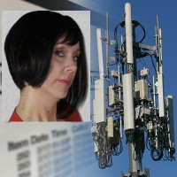 Woman with chin-length black hair with a cell phone tower in the background