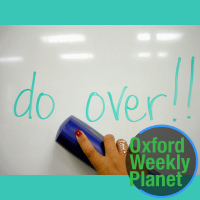 whiteboard with "do over!" written on it and the Oxford Weekly Planet logo in the foreground