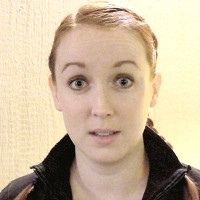 Young woman with hazel eyes and long red hair