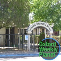 Front entrance to Yoknapatawpha Acres nursing home with the Oxford Weekly Planet logo in the foreground