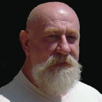 Older bald man with white beard and mustache