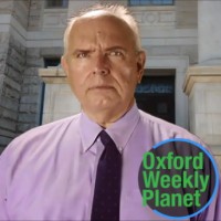 Balding man in shirt and tie outside a courthouse