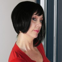 Woman with chin-length black hair