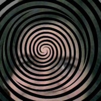 Hypnotic spiral with a woman's face in the background