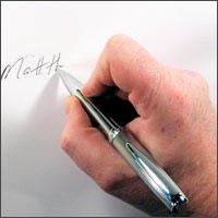 hand with pen writing name