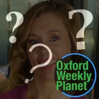 Question marks and the Oxford Weekly Planet logo with a smiling woman with long blonde hair in the background