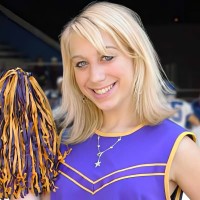 Smiling blonde young woman in a cheerleading outfit