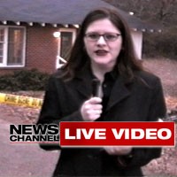 A local TV news reporter is live at the crime scene