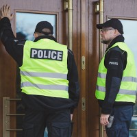Officers knocking on a residence door