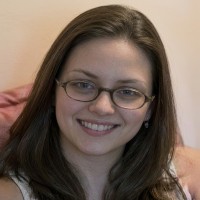 Smiling brunette woman with glasses