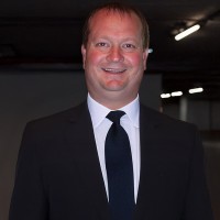 Smiling man with thinning hair