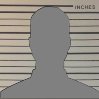 Human silhouette in front of a police booking height chart