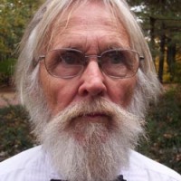 Older man with glasses and white hair, beard and mustache