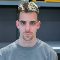 Dark-haired man with a mustache and goatee