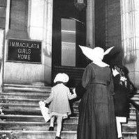 Old photo of a nun and two children entering the Immaculata Girls Home