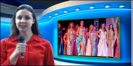 News reporter with microphone in front of a TV studio screen showing footage from a beauty pageant