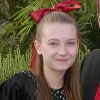 Young girl in a party dress and a bow in her hair