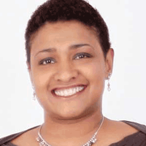 Smiling woman with close-cropped dark hair