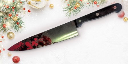 Large chef's knife with red stains on a winter holiday background