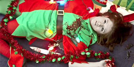 Woman in an elf costume lying dead on the floor
