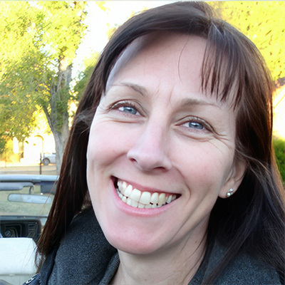 Smiling woman with long dark hair