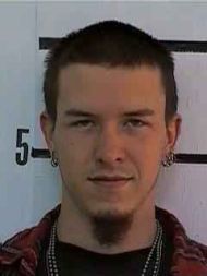 Young man with dark hair and goatee