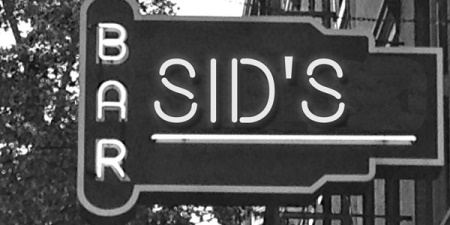 Neon sign reading 'Sid's Bar'