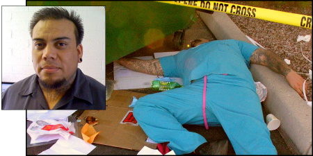 Man in scrubs lying dead between a dumpster and the curb